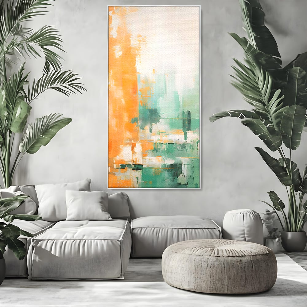 Tablou canvas cu pictura abstracta cu portocaliu si turcoaz, in rama de aluminiu argintiu, pe perete intr-un living